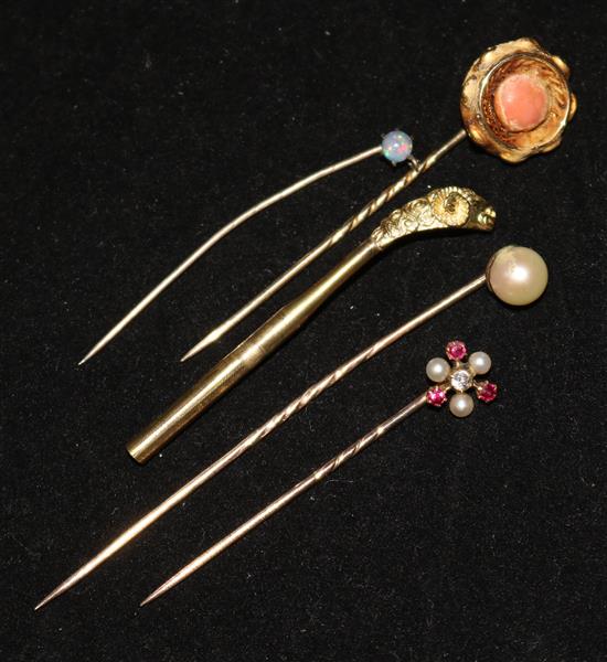 Four gem set tie pins and dog hat pin top.